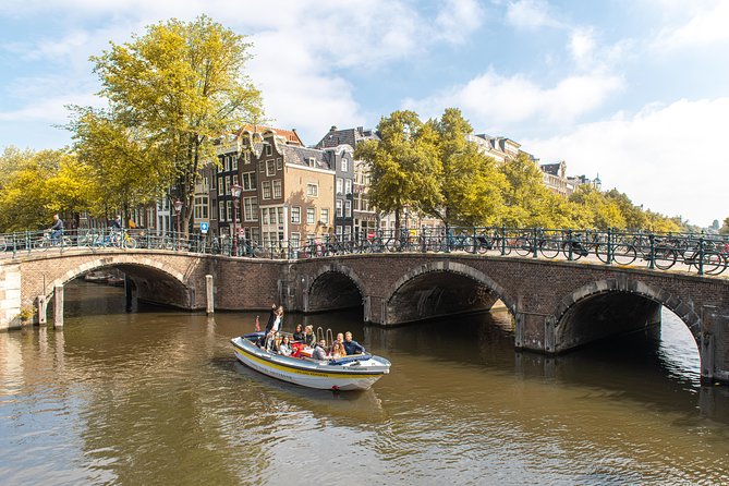 Amsterdam Open Boat Tour with Local Guide - Step-by-step Journey Through Amsterdam’s Famous Canals