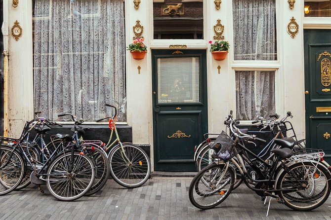 Amsterdam PRIVATE Bike Tour With Locals: Bike & Local Snack Included - Exploring the City’s Quirky and Historic Sides