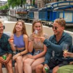Amsterdam: Red-Light District Pub Crawl and Booze Boat Tour - Starting Point and Cruise Experience in Amsterdam’s Canals