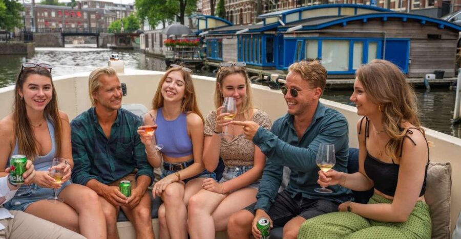 Amsterdam: Red-Light District Pub Crawl and Booze Boat Tour - Starting Point and Cruise Experience in Amsterdam’s Canals