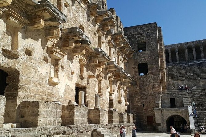 Apollo Temple, Perge Ancient City, and Waterfalls Tour with Lunch - Exploring Perge Ancient City: Roman Elegance and Sculptures