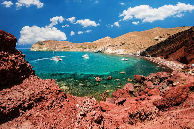 Archaeological bus tour to Akrotiri excavations & Red beach - Red Beach: Colorful Cliffs and Free Time for Swimming