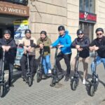 Barcelona: Tour history on scooters and e-bikes with discount cards - Starting Point: Convenient Pickup at Paseo Colon 17