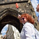 Best of Prague: Private City Walking Tour, Boat Cruise, and Typical Czech Lunch - Crossing the Iconic Charles Bridge