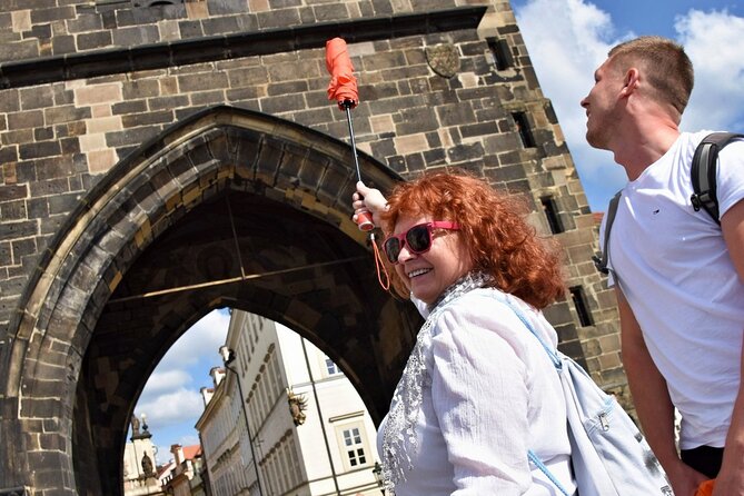 Best of Prague: Private City Walking Tour, Boat Cruise, and Typical Czech Lunch - Crossing the Iconic Charles Bridge