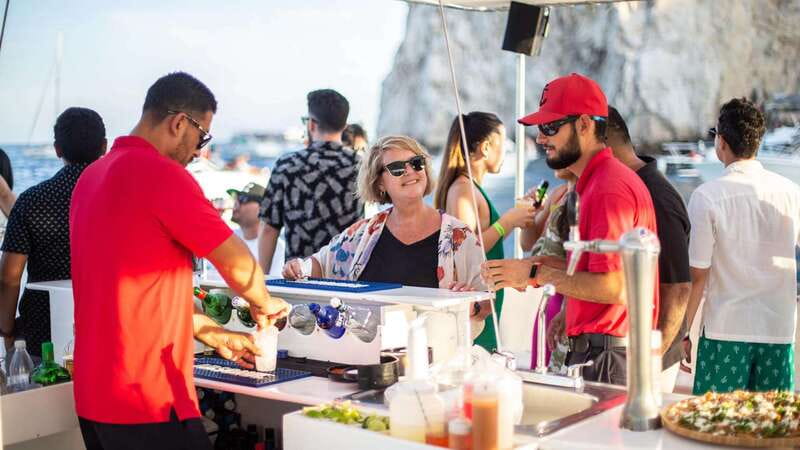 Cabo San Lucas: Sunset Party Cruise with Open Bar - The Atmosphere on the Catamaran: Music, Dancing, and Views