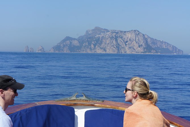 Capri & Blue Grotto Small Group Full-Day Boat Tour from Positano - Onboard Experience: Drinks, Relaxation, and Scenic Cruising
