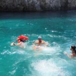 Capri Private Boat Tour 6 hours - Admiring the Iconic Faraglioni Rocks and the White Grotto