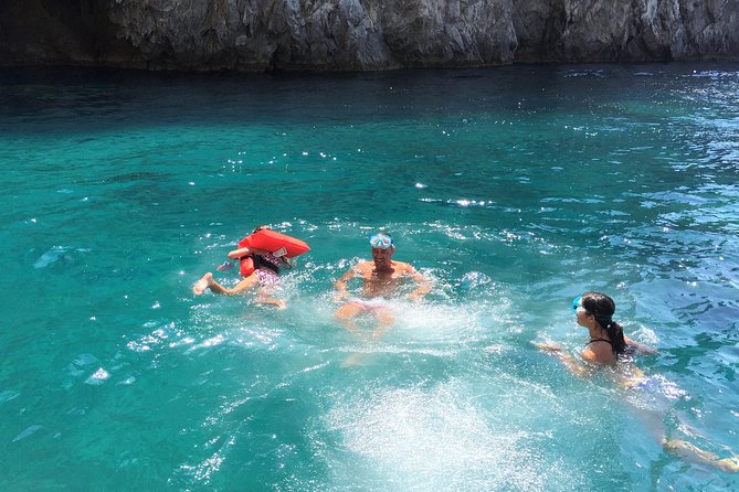 Capri Private Boat Tour 6 hours - Admiring the Iconic Faraglioni Rocks and the White Grotto