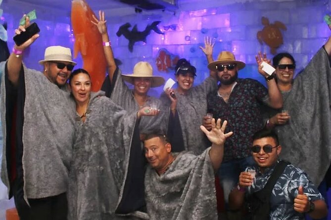 Catamaran to Isla Mujeres + Ice Bar pass: Open bar all day! - Snorkeling at El Meco Reef: Vibrant Marine Life and Coral Gardens