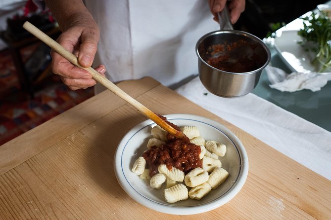 Cesarine: Market Tour & Cooking Class at Local's Home in Lucca - Meet Your Host at a Cozy Lucca Home