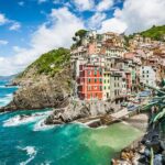 Cinque Terre Private Tour by Minivan and Ferry-Boat from Pisa - Discover Riomaggiore: The First Village of the Day