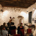 Classical guitar concert in a historic olive press - Meet the Master Guitarist Nikos Karavias