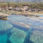 Demetris Chara Boat/Blue Lagoon boat trips with BBQ and SLIDE - Arriving at the Blue Lagoon for Swimming and Snorkeling