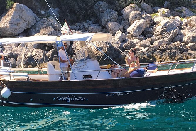 Exclusive Boat Tour to Capri with Swim Stop and Aperitif - Cruising Past the Faraglioni Rocks