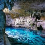 Explore the Tulum ruins, incredible cenotes and a famous sculpture. - Exploring the Tulum Archaeological Site