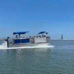 Folly Beach: Sunset Dolphin Boat Tour to Morris Island - Visiting Morris Island and Its Historic Lighthouse