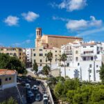Full Day Mahon Harbour, Binibeca and Xoroi Cave Tour in Minorca - Strolling Through Binibeca: A Village of Whitewashed Charm