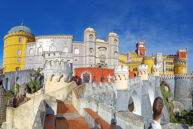 Group to Pena Palace, Sintra (pass by Regaleira) and Cascais - Visiting Pena Palace’s Vibrant Facades and Fascinating Myths
