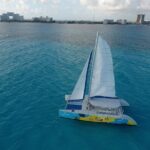 Guided Full Day Catamaran Isla Mujeres Pleasure Tour in Cancun - Visiting Zona Arqueologica El Meco and Snorkeling at Reef Musa