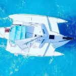 Isla Mujeres Premium Tour in Private Catamaran with Lunch - Snorkeling at El Meco Reef: Colorful Fish and Underwater Statues