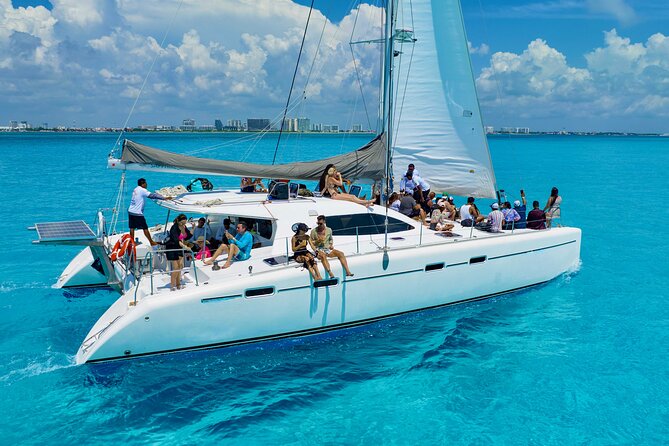 Isla Mujeres Spring Break Party Catamaran Snorkel and Open Bar - The Meeting Point at Playa Tortugas Marina