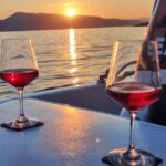 Krk: Sunset Boat Tour with wine, high chance of dolphins - Key Points