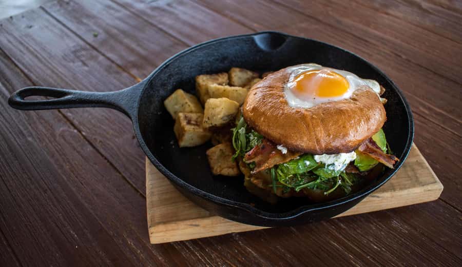 Land's End Paddle Boarding and Breakfast Tour - Paddleboarding Toward the Iconic Los Arcos