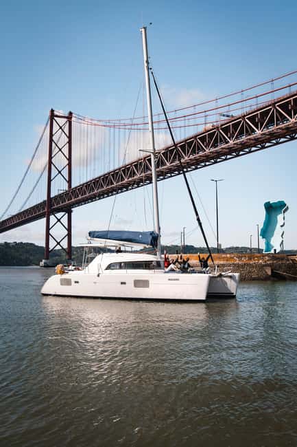 Lisbon: Sightseeng & Sunset Sailing Boat with a Local Guide - Cruising Past Lisbons Iconic Landmarks