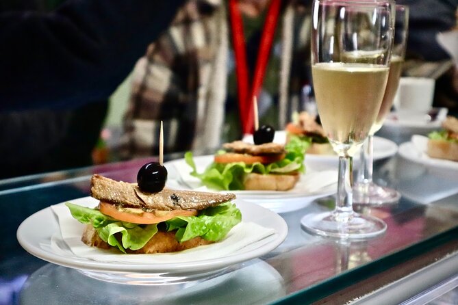 Lisbon Walking Food Tour: Tapas and Wine with Secret Food Tours - Tasting Local Specialties at Handpicked Eateries