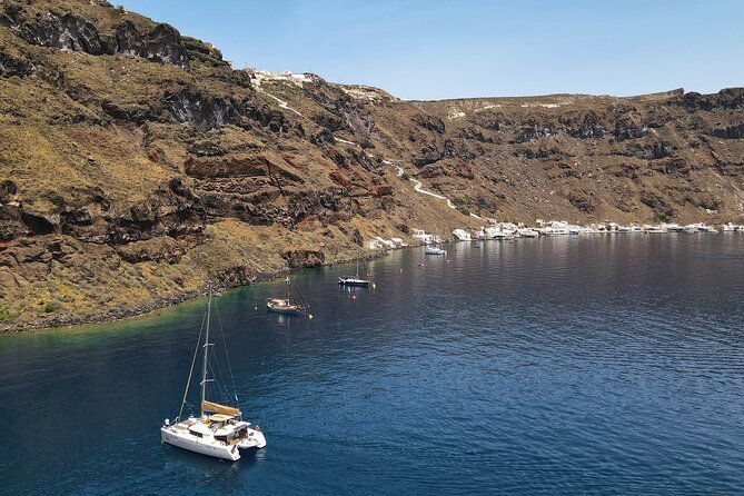 Luxury Santorini Sunset Cruise: Dinner, BBQ, Open Bar, Transfers - Exploring Santorinis Iconic Coastal Landmarks