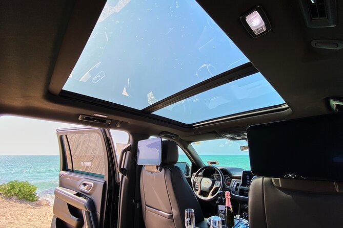 Luxury Suv departures from Tulum to Cancun Airport - High-End Vehicle with Bar Service and Comfort Features