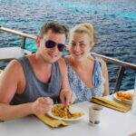 Menorca: Full-Day Boat Tour with Paella Lunch - Visiting Cala en Turqueta: Two Hours of Beach Relaxation and Swimming