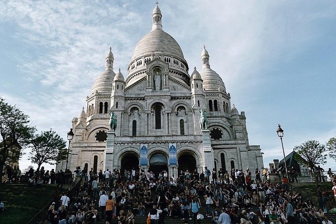 Montmartre District and Sacre Coeur - Exclusive Guided Walking Tour - Exploring the Iconic Moulin Rouge and Artist Residences