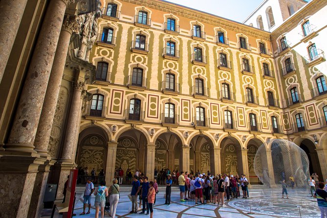 Montserrat & Winery Visit Tour with Traditional Farmhouse Lunch - Visiting Montserrat Monastery and Its Iconic Black Virgin