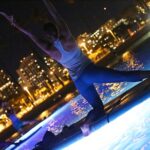 Night SUP Yoga in Honolulu, Hawaii - Learning to Stand-Up Paddleboard in a Calm Ocean Setting