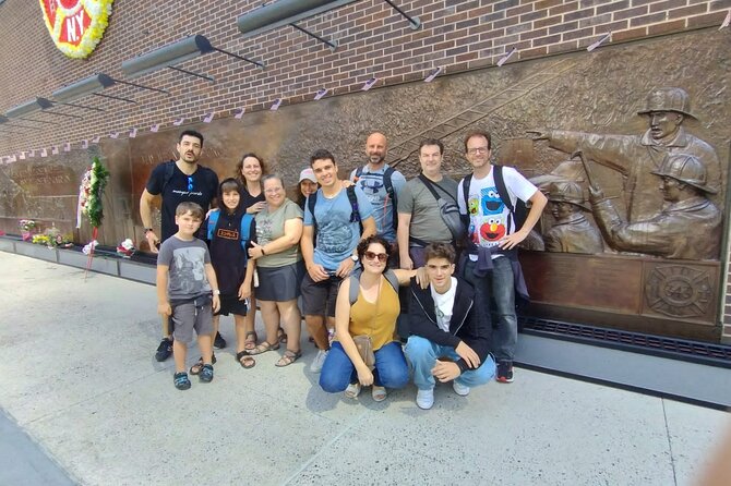NYC Essential Guided Walking Tour of Manhattan - The Symbol of Hope at Charging Bull on Wall Street