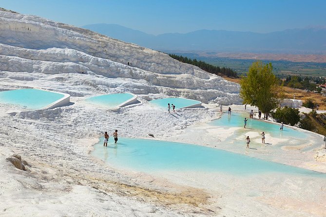 Pamukkale and Hierapolis Tour with Expert Guide From Kusadasi - Walking Through the Unique Geology of Pamukkale