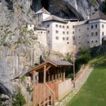 Postojna Cave & Photostop Predjama castle - Group Tour from Koper - The Fascinating Journey Inside Postojna Cave