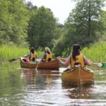 Premium guided Canoe Tour in lake Plateliai Handcrafted inventory and picnic set - The Handmade Cedar Strip Canoe: A Key Highlight
