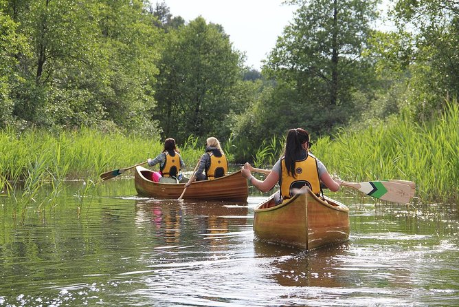 Premium guided Canoe Tour in lake Plateliai Handcrafted inventory and picnic set - The Handmade Cedar Strip Canoe: A Key Highlight
