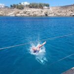 Private sailing cruise to Delos & Rhenia with Lunch & Transfer - Sunbathing and Swimming at Rhenias Solitary Beaches