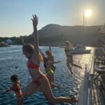 Rhodes: Bay to Bay Swim Cruise with Greek Buffet and Wine - Departure from Mandraki Port and Initial Coastline Views
