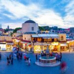 Rhodes: Guided Rhodes City By Night with Live Music & Dinner - From Pickup to Scenic Views of Rhodes Harbor