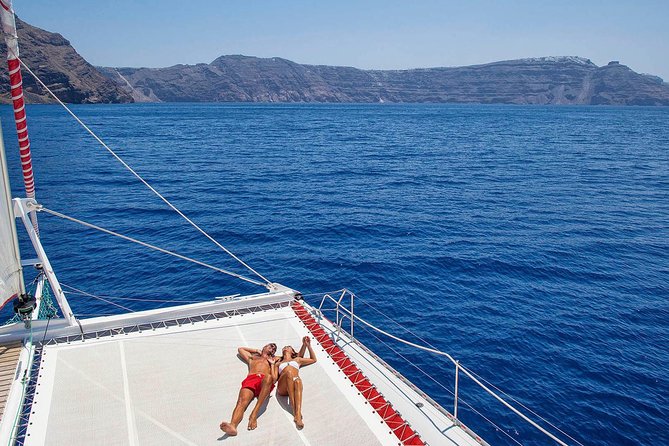 Santorini Cruise on Catamaran with BBQ & Open Bar - Unique Photos and Snorkeling at Red Beach