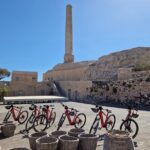 Santorini: E-bike tour experience - Discovering the Unique Black Sand Beach at Perissa