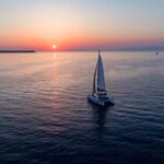 Santorini: Private Sunset Cruise with Dinner and Drinks - Departure from Vlychada Beach and the Scenic Start