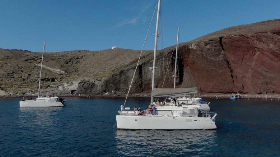 Santorini: Sunset Cruise with Greek Dinner and Transfer - From Hotel Pickup to Scenic Departure from Multiple Locations