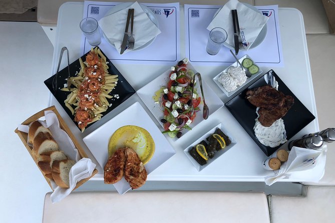 Santorini Sunset Luxury Sailing Catamaran Cruise with BBQ, drinks, transfer - Exploring Santorini’s Iconic Beaches: Red Beach and White Beach