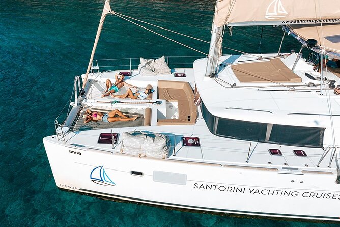 Santorini Sunset Sailing Cruise: Dinner, BBQ, Open Bar, Transfers - Visiting the Renowned Red Beach for Sightseeing and Swimming